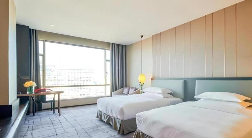 Maison New Century Hotel Dongguan Дунгуань Экстерьер фото